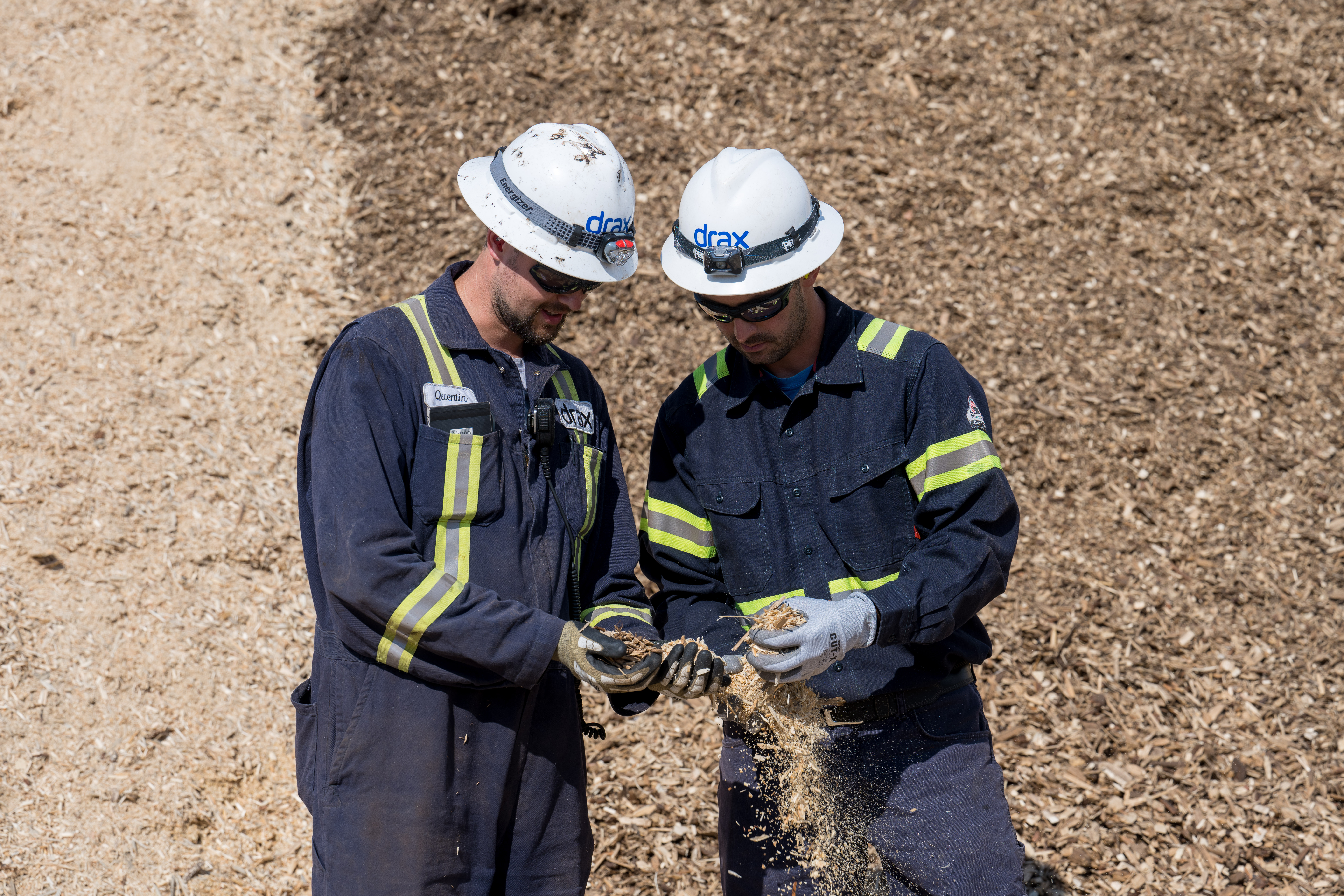 Drax pellet plant workers, holding wood chippings