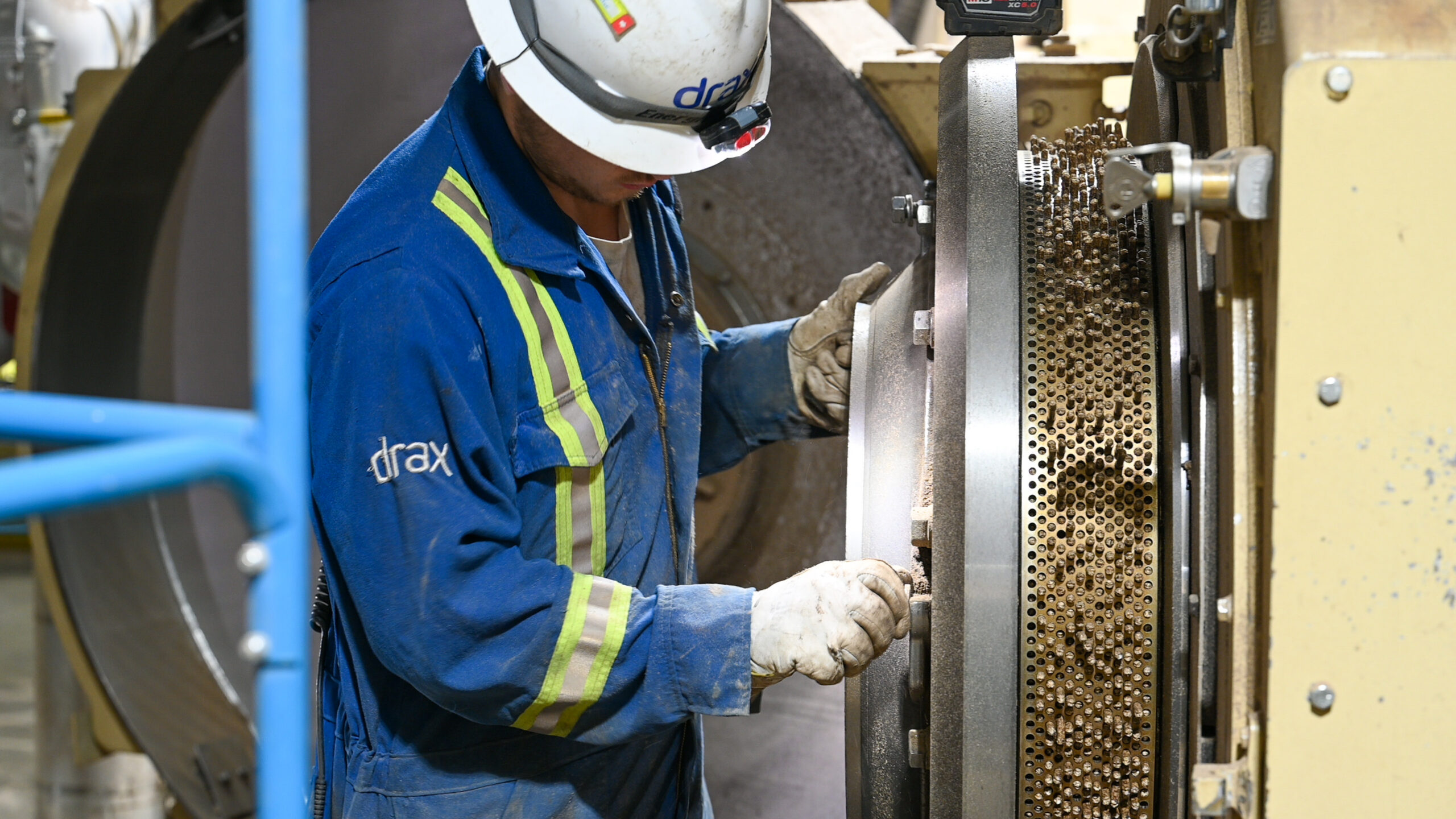 Drax worker in PPE producing sustainable biomass pellets