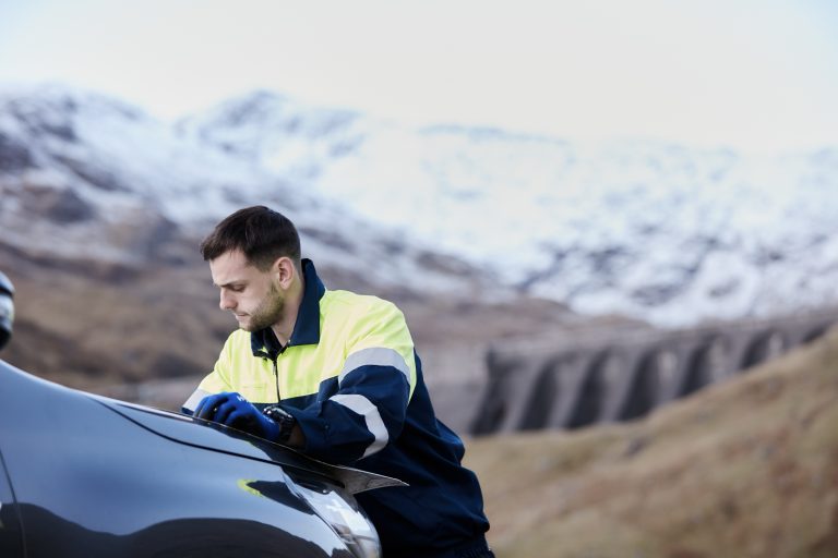 Engineer planning work near Cruachan Power Station dam and reservoir 