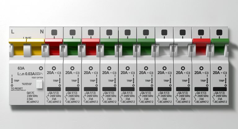 A row of switched on household electrical circuit breakers on a wall panel