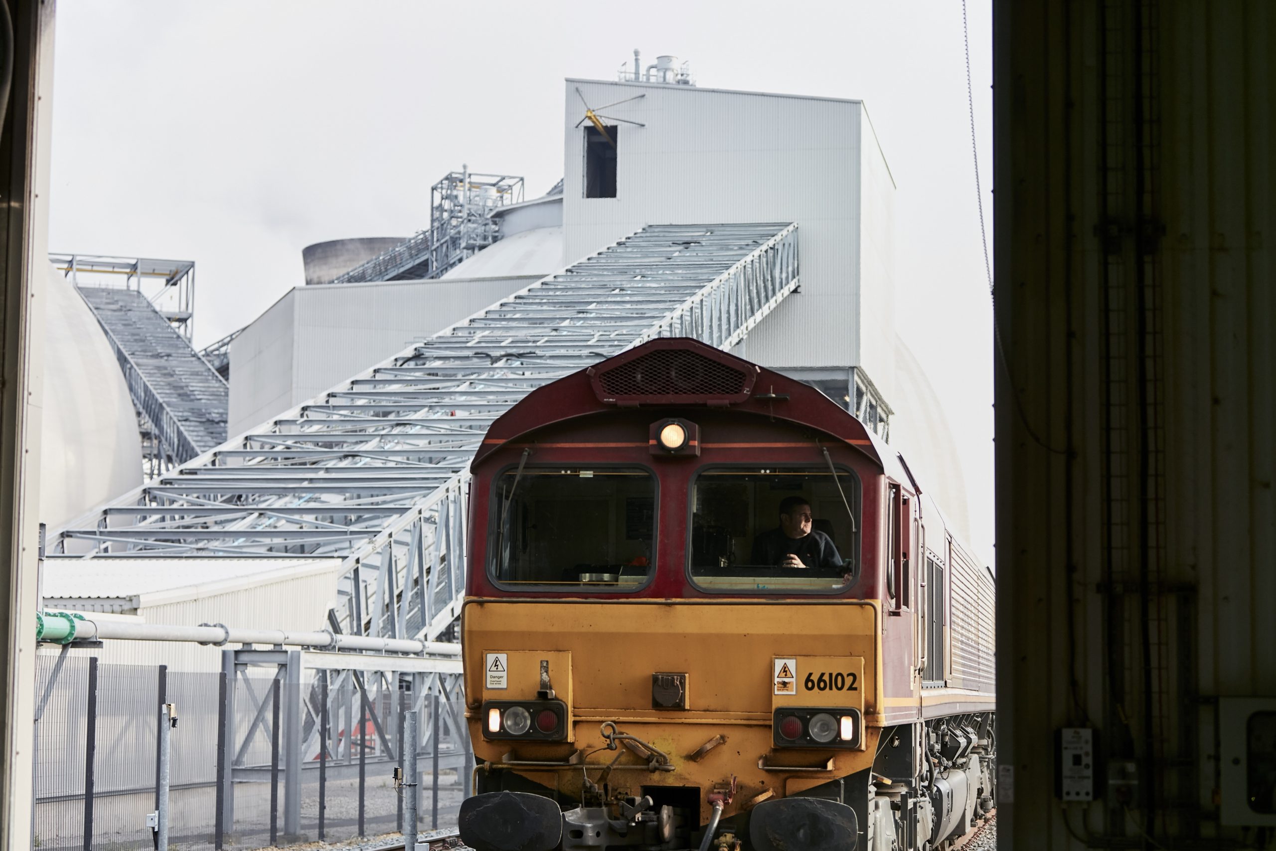 Train arriving at Selby, Selby Power Station, Yorkshire, UK, 2019