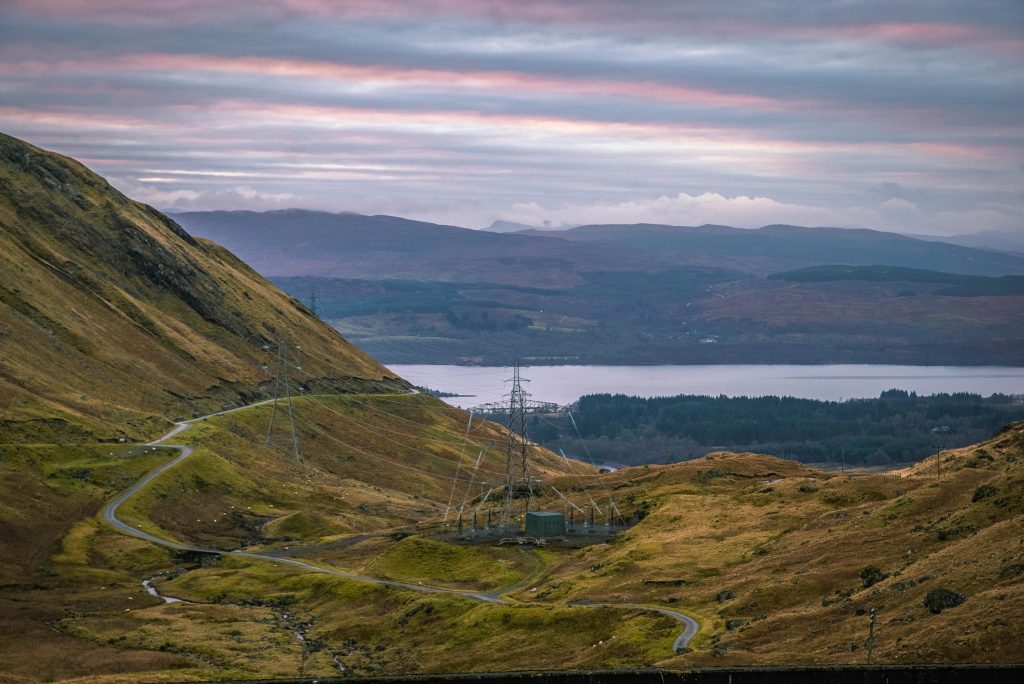 Power lines and pylon above Cruachan Power Station, viewed from Ben Cruachan above