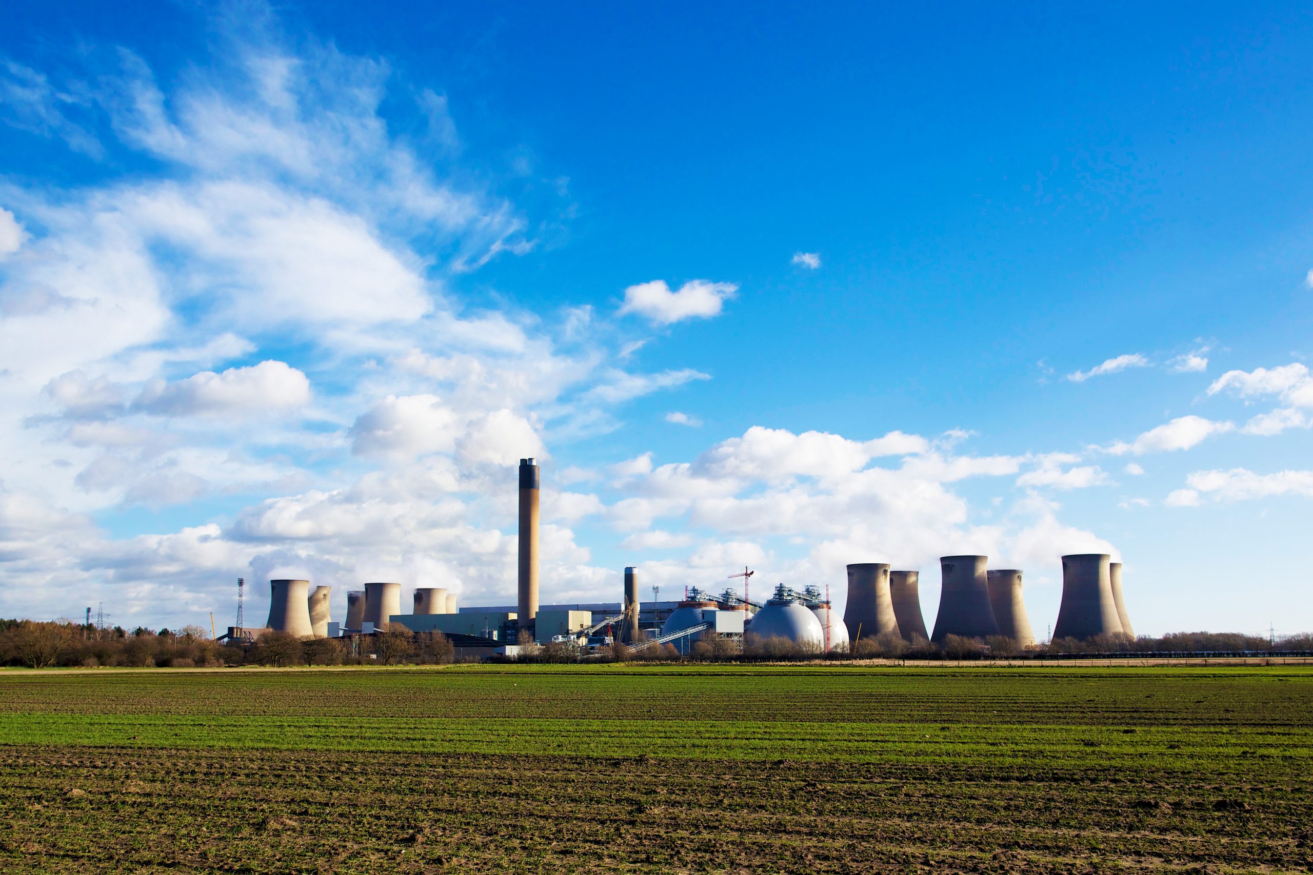 Drax Power Station with biomass domes on a blue sky day