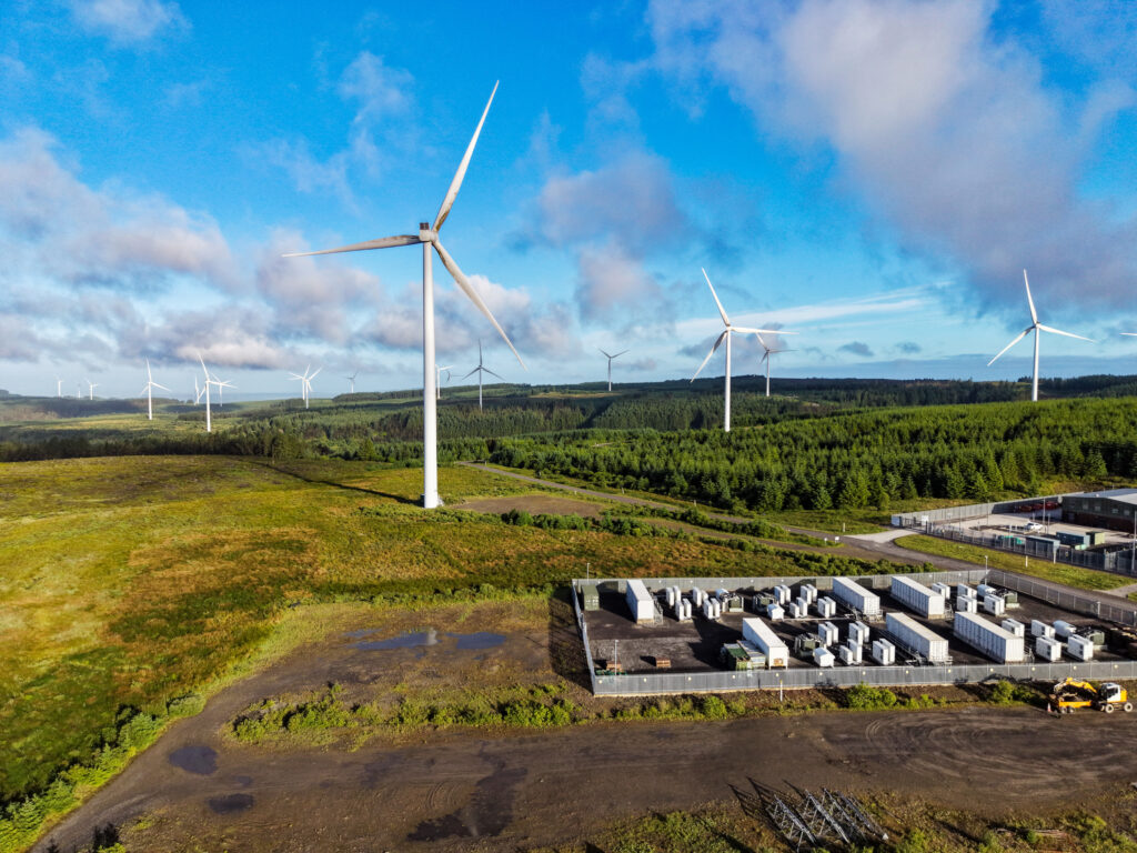 Battery energy storage site and wind turbines