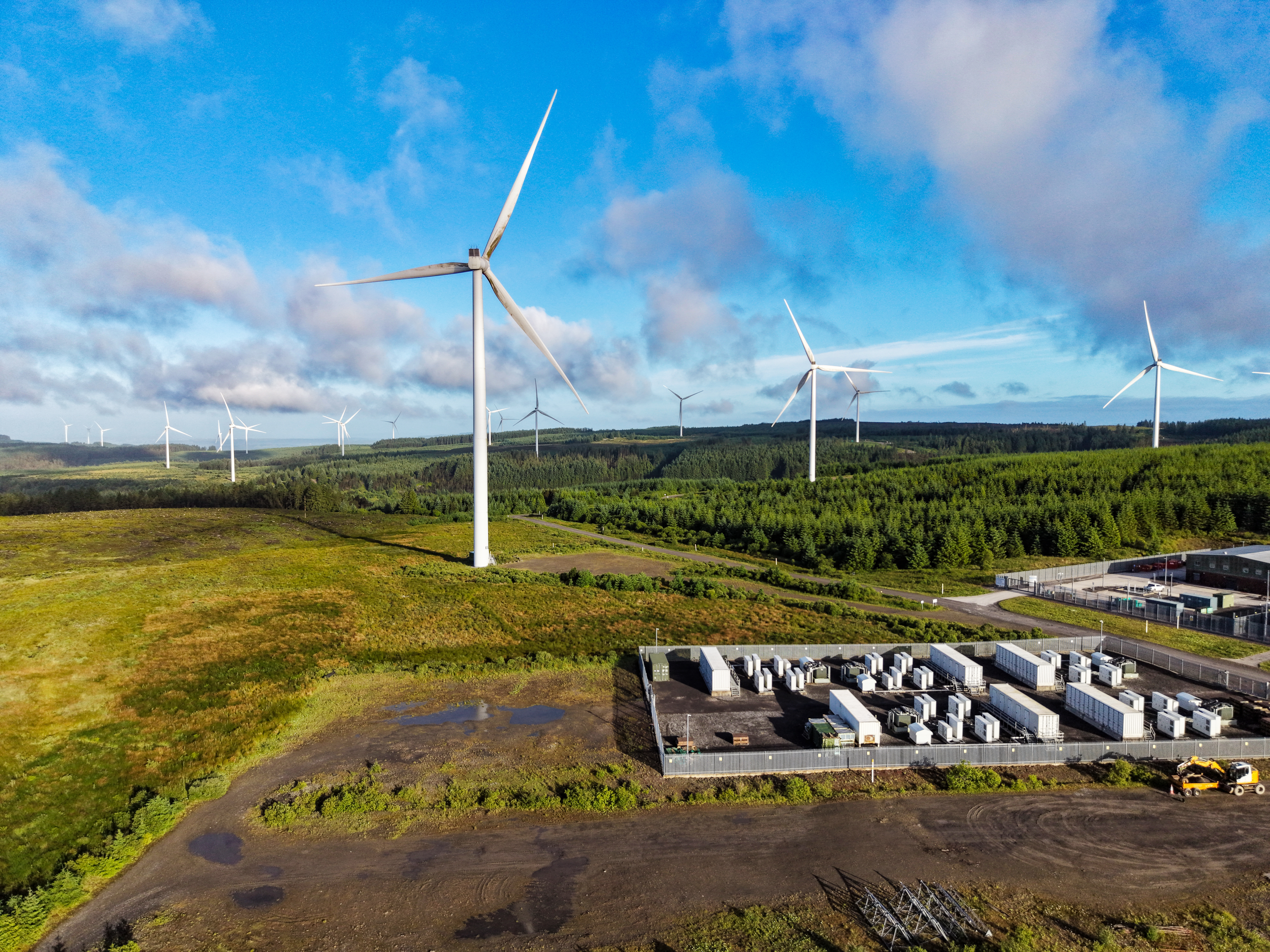 Battery energy storage site and wind turbines