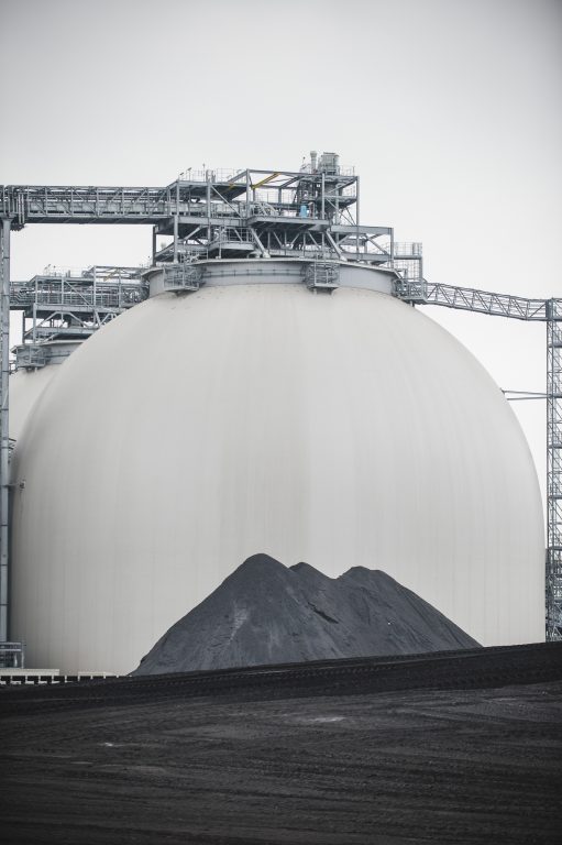 Coal in front of biomass storage domes at Drax Power Station, 2016