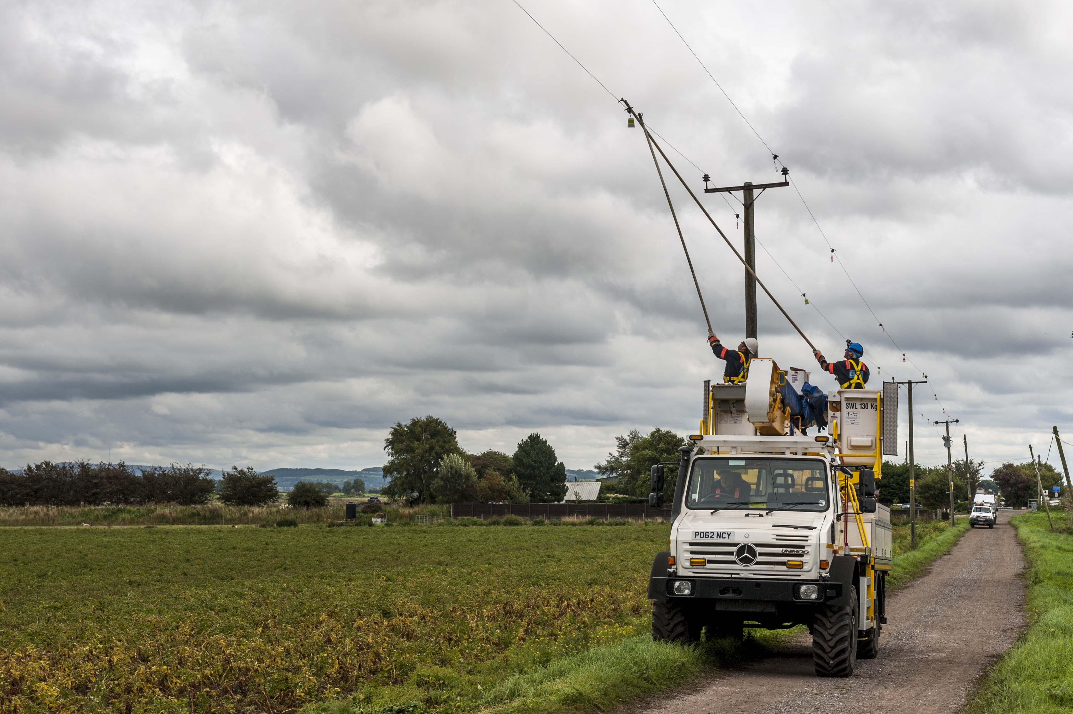 Engineers from Electricity North West fixing electricity wires.