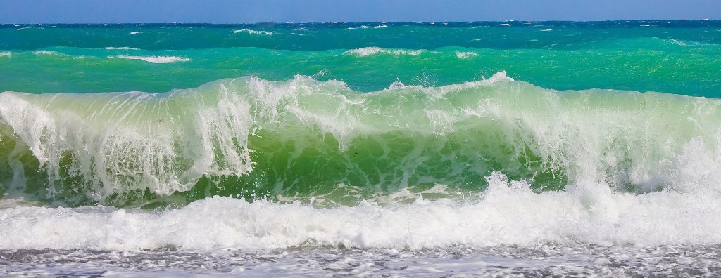 Ocean wave crashing at shore