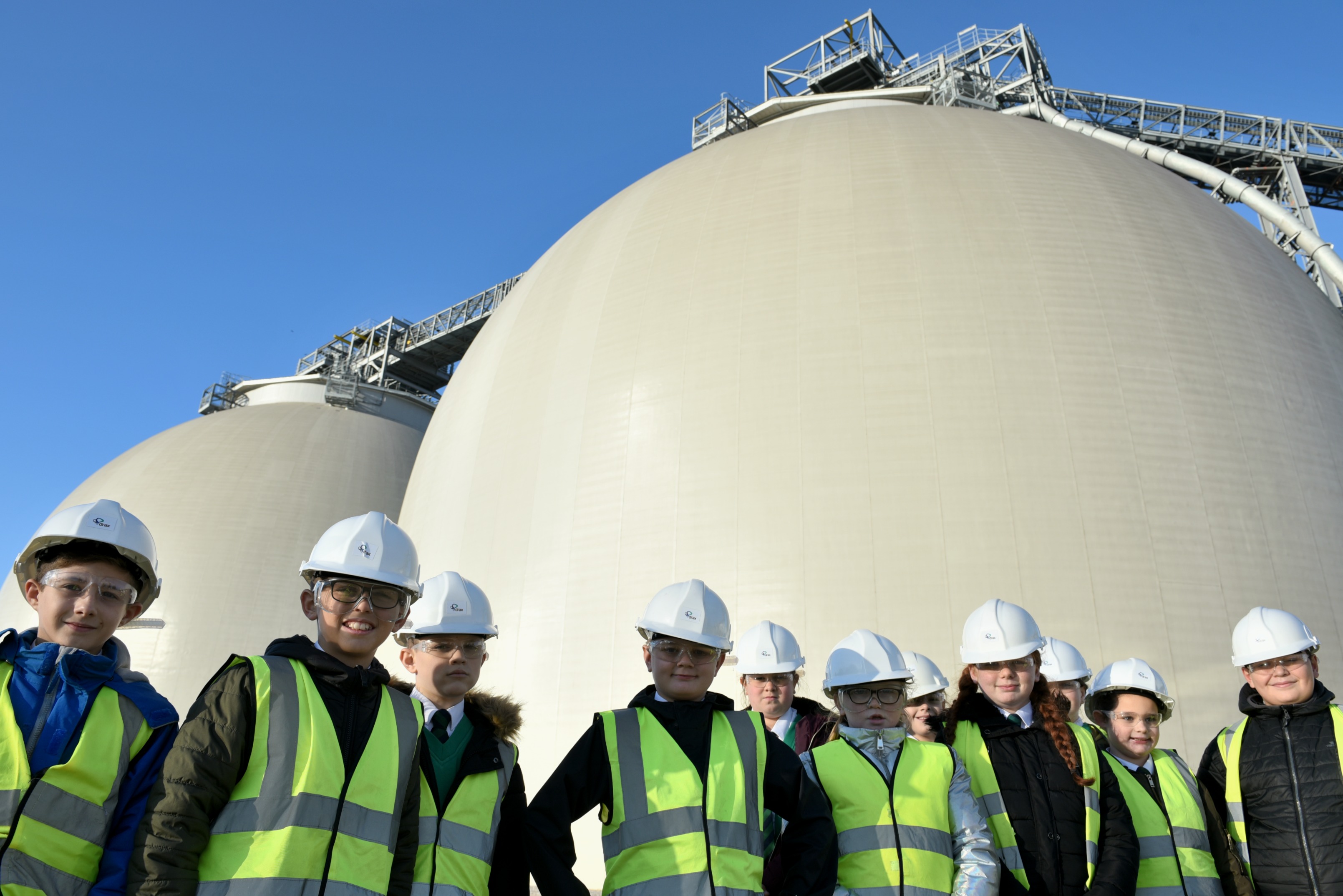 Students from Airedale Junior School standing outside the Biomass Domes at Drax Power Station