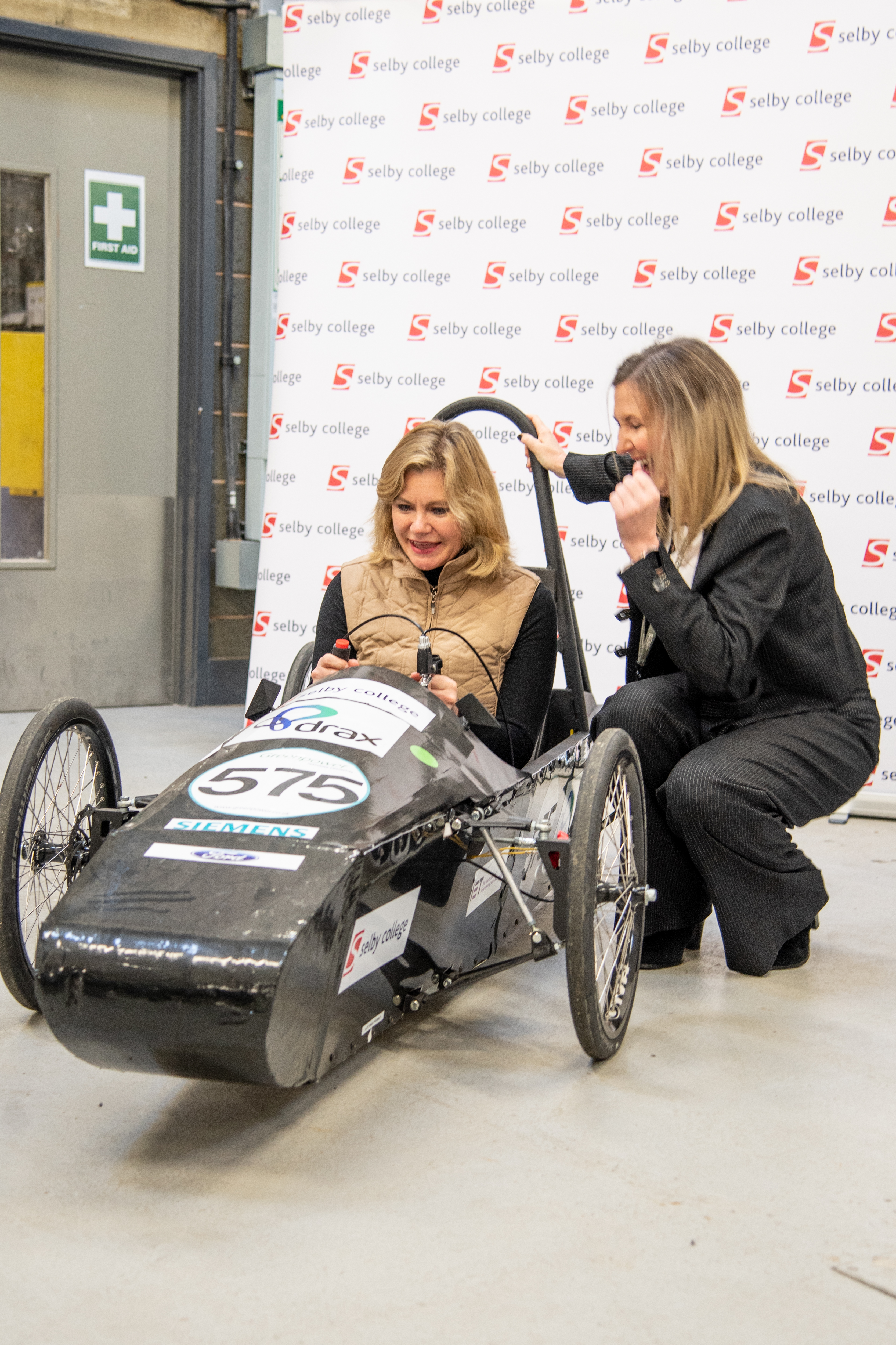 Justine Greening at Selby College in electric car