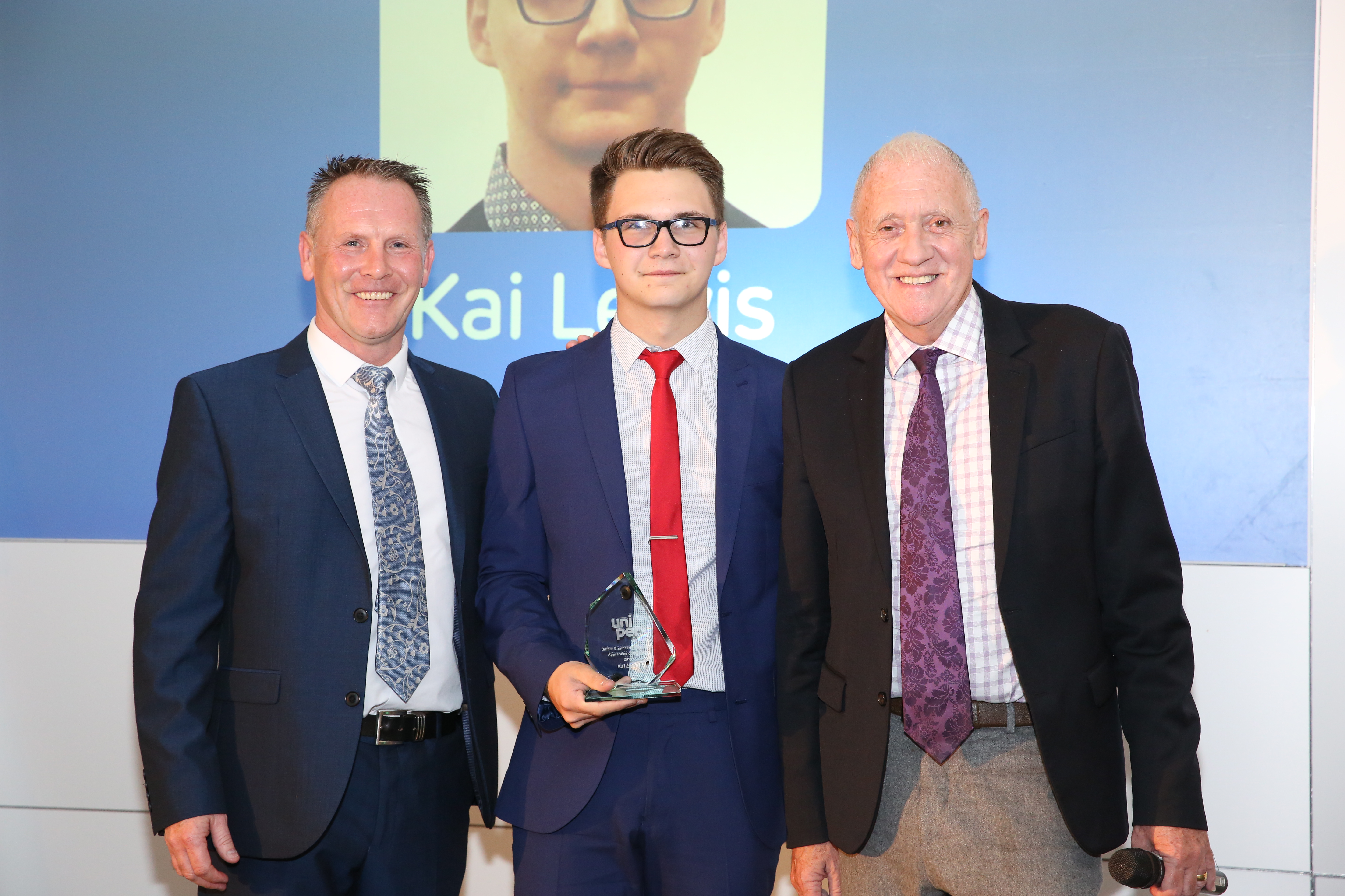 Photo of Kai Lewis (centre) receiving the Uniper Engineering Academy Apprentice of the Year Award alongside Mike Maudsley (left), Drax’s UK Portfolio Generation Director and BBC Look North’s Harry Gration (right).