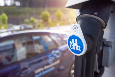 Car arriving at hydrogen gas station