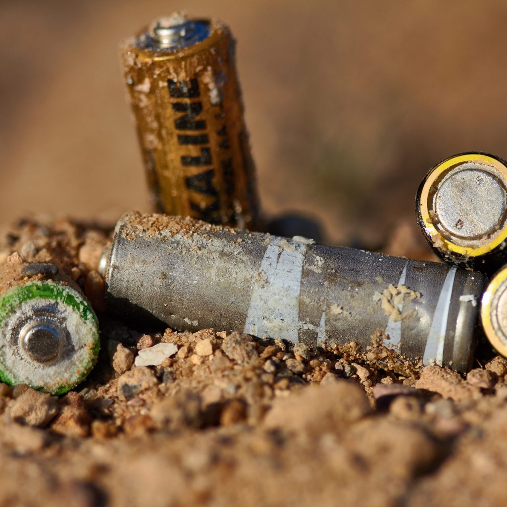 Wrong disposal of batteries. Discarded batteries. Pollution of the