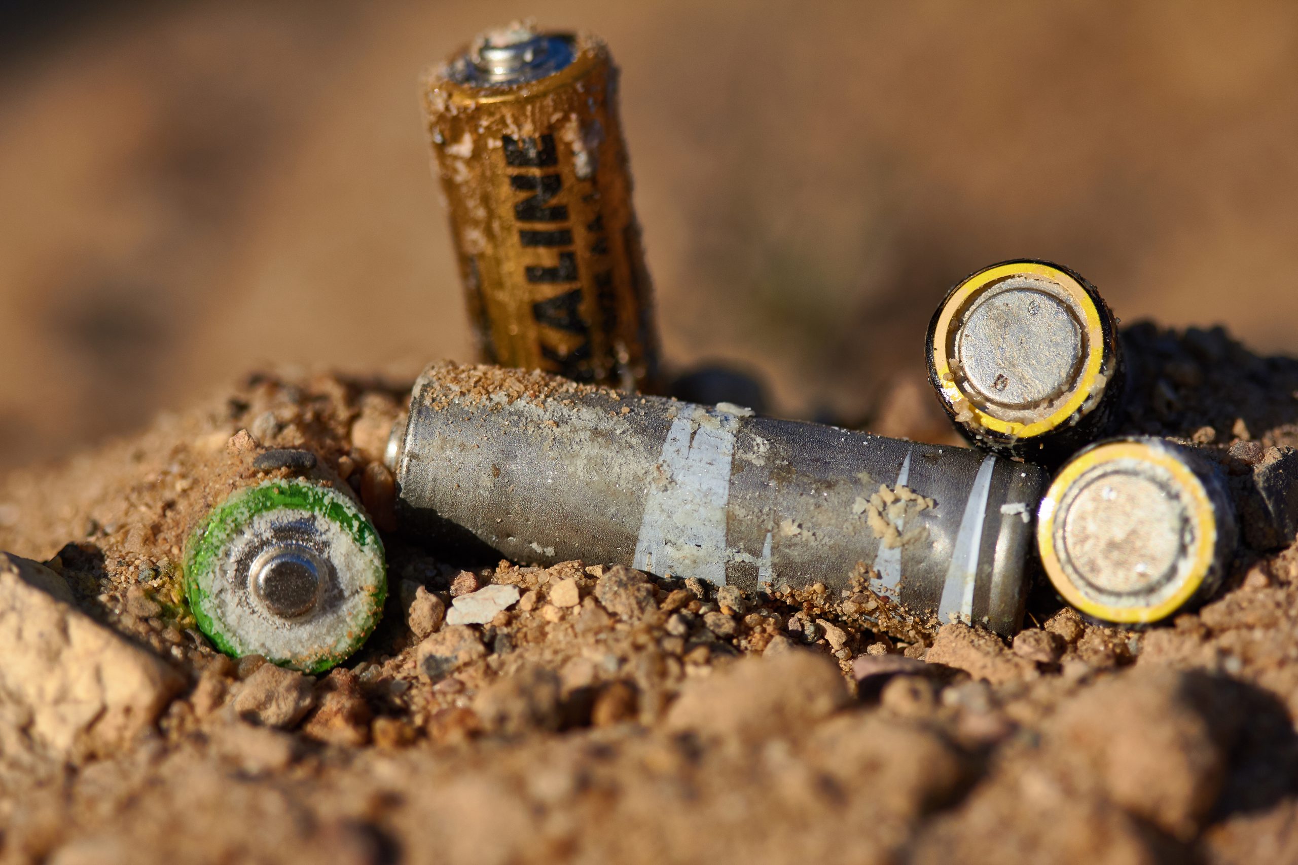 Wrong disposal of batteries. Discarded batteries. Pollution of the