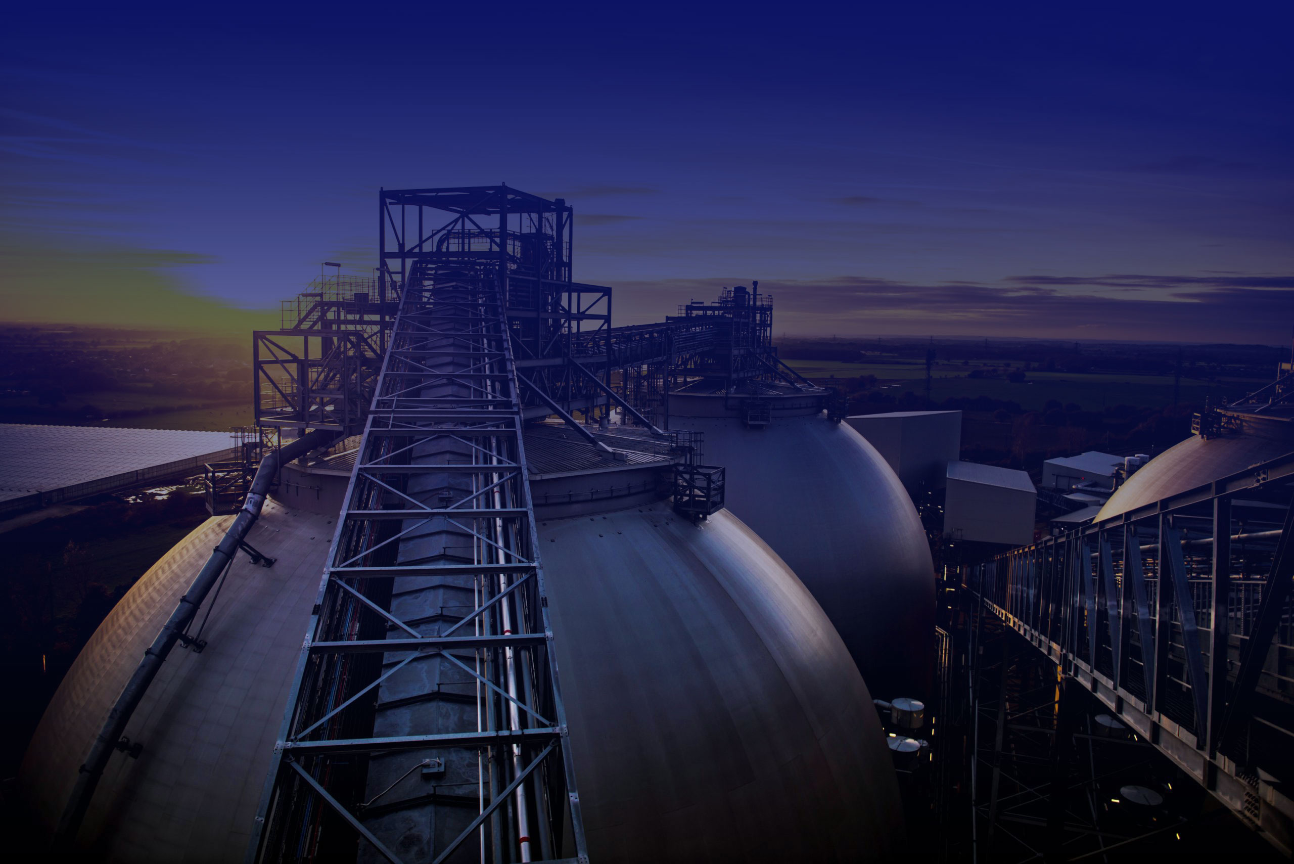 Sunset behind biomass storage domes at Drax Power Station in North Yorkshire