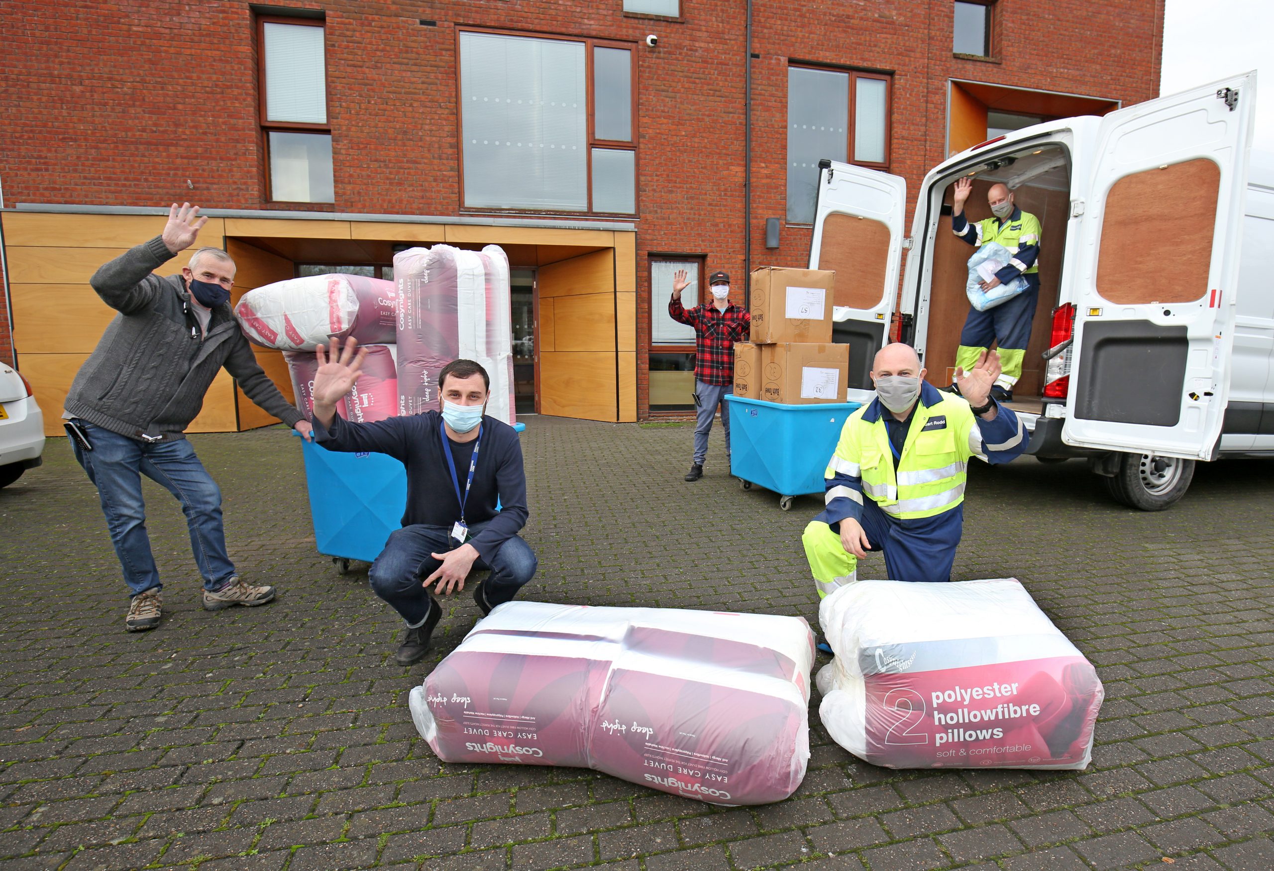 Phil Barnes, James Ford and Rich Grainger from Changing Lives York, Stuart Rodd and Andy Westley from the Drax facilities team in front of the Union Terrace homeless shelter in York
