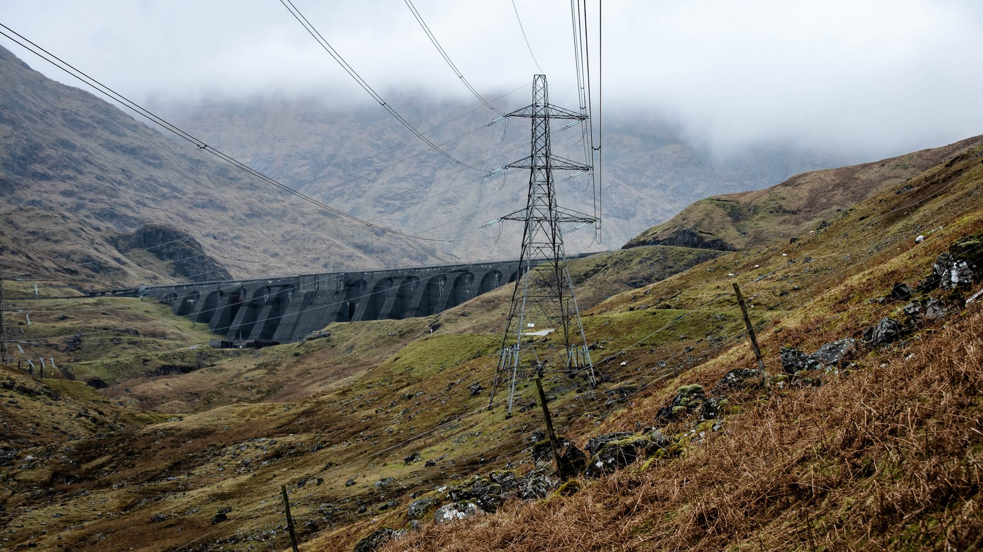 Electricity pylons take flexible power generated from water stored in a reservoir at Cruachan Power Station in the Highlands into the national grid