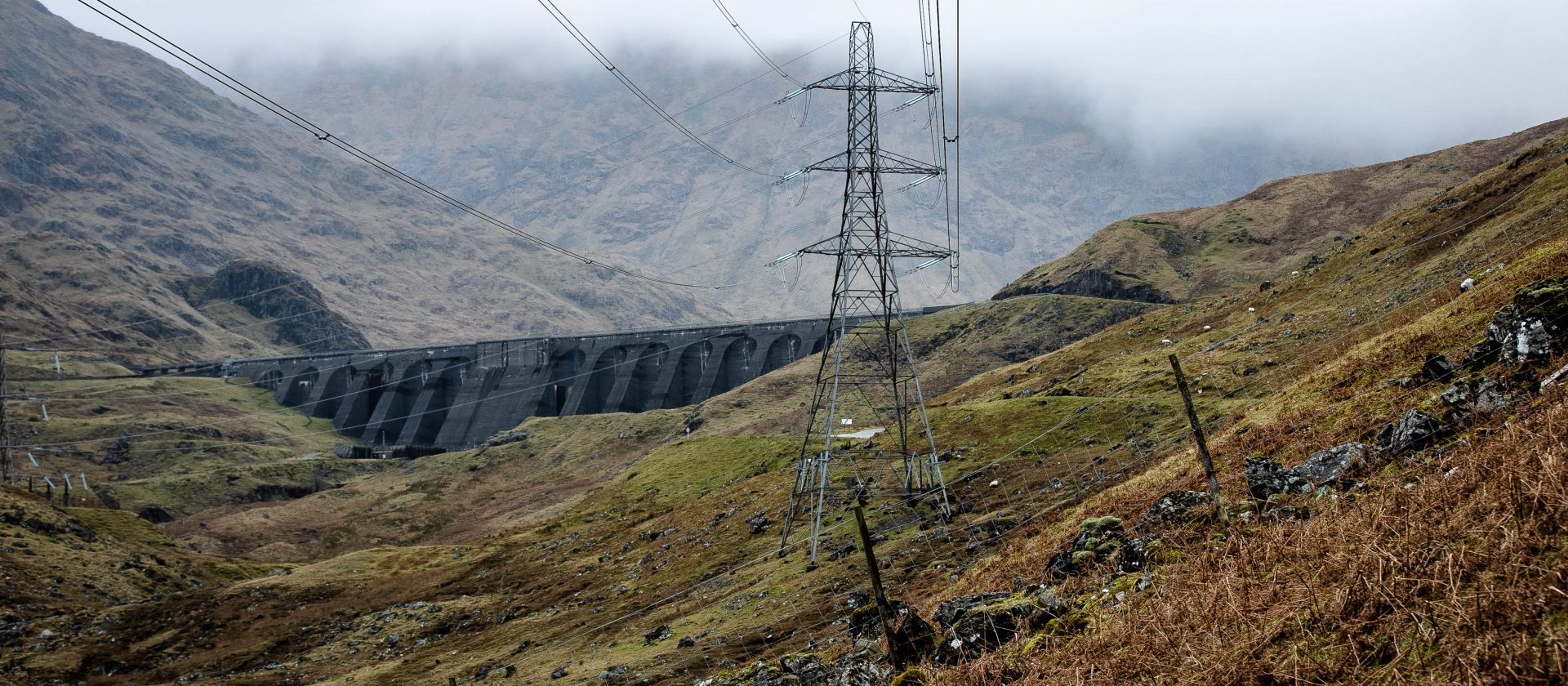 Electricity pylons take flexible power generated from water stored in a reservoir at Cruachan Power Station in the Highlands into the national grid
