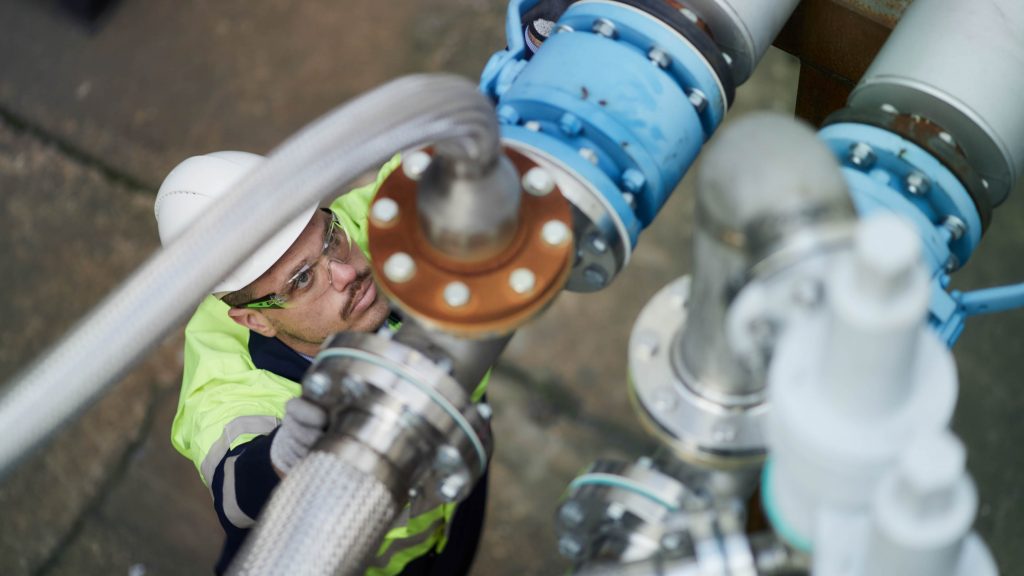 Innovation engineer inspects pilot carbon capture facility at Drax Power Station