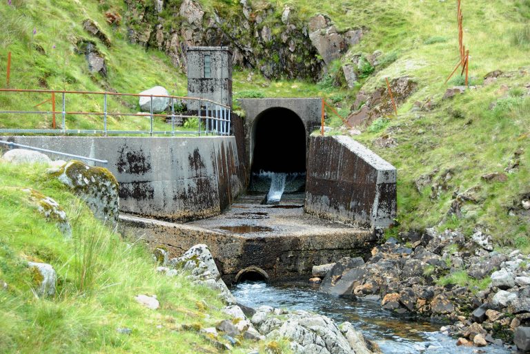 Aqueduct supplying water into the reservoir at Cruachan pumped hydro storage plant in Scotland 