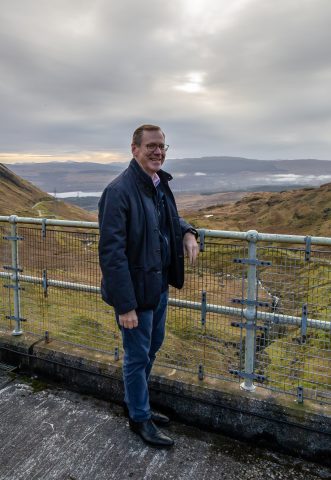 Drax CEO Will Gardiner on top of dam above Cruachan Power Station, Argyll and Bute